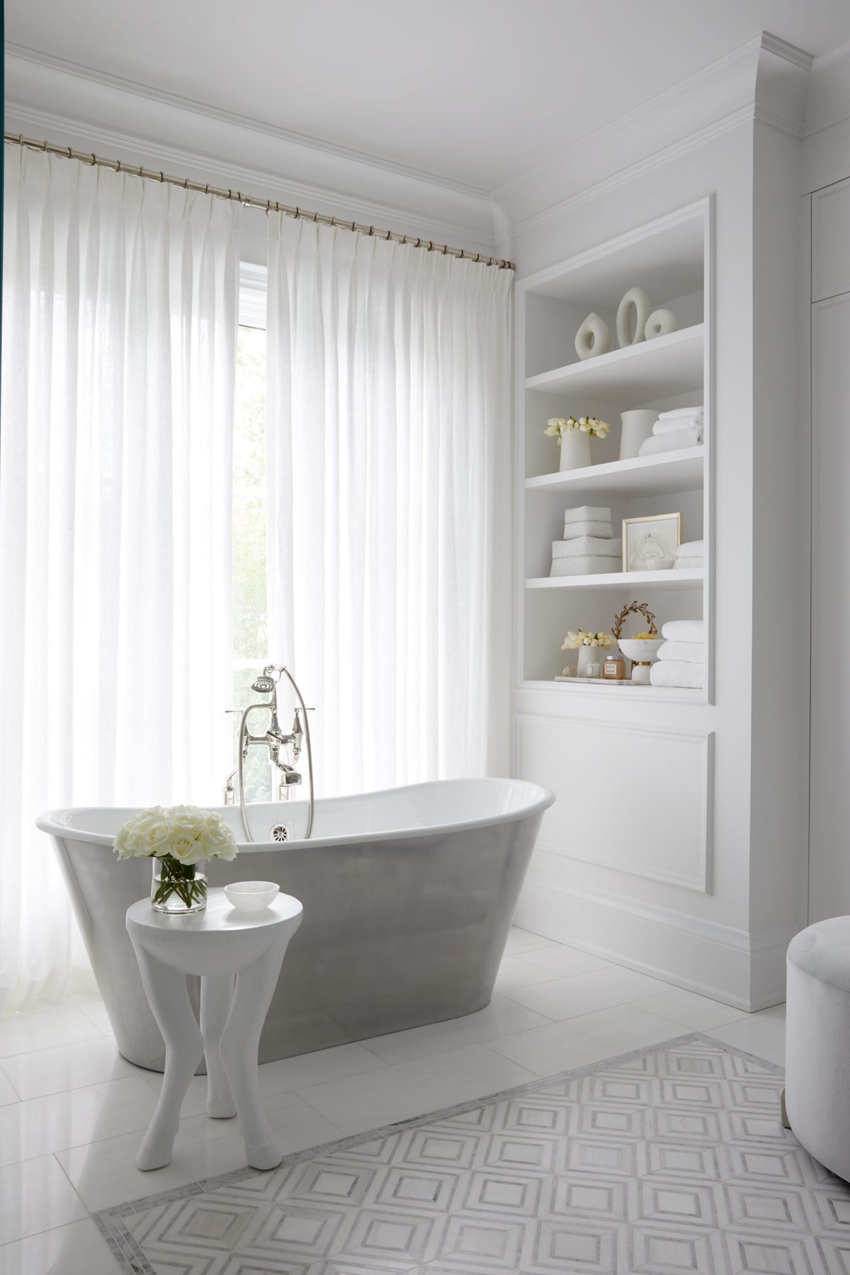 Bathroom with freestanding tub and sheers
