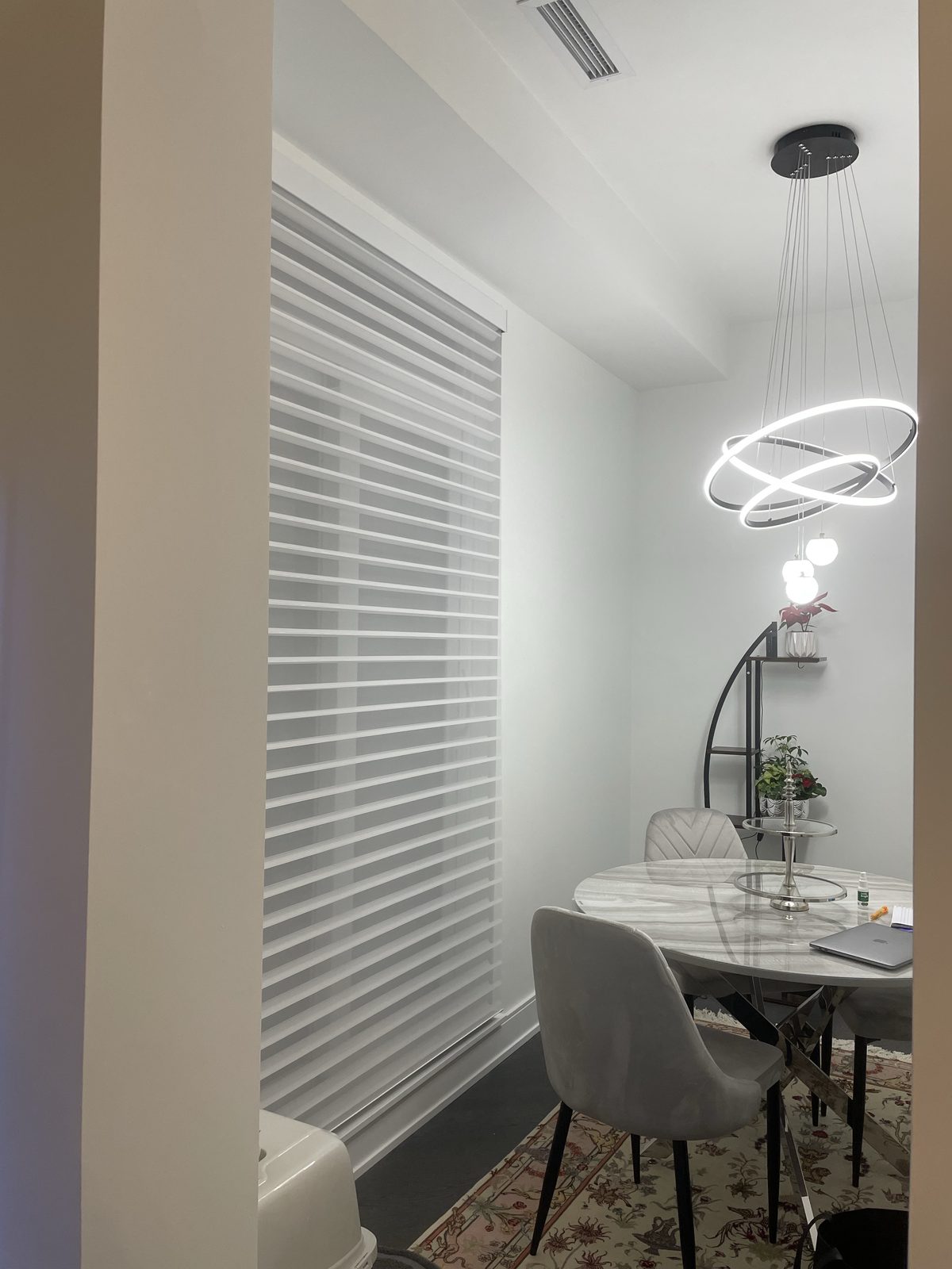 Dining nook with zebra blind