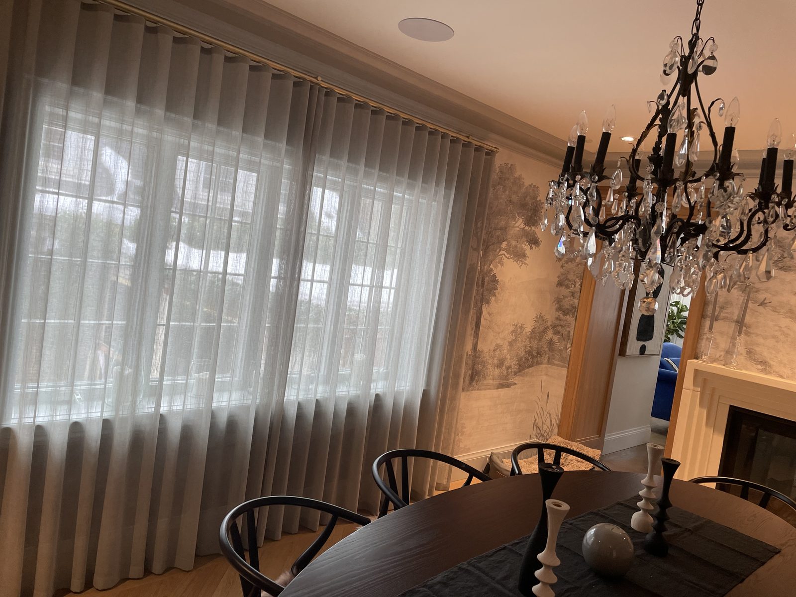 Dining room with sheers, crystal chandelier