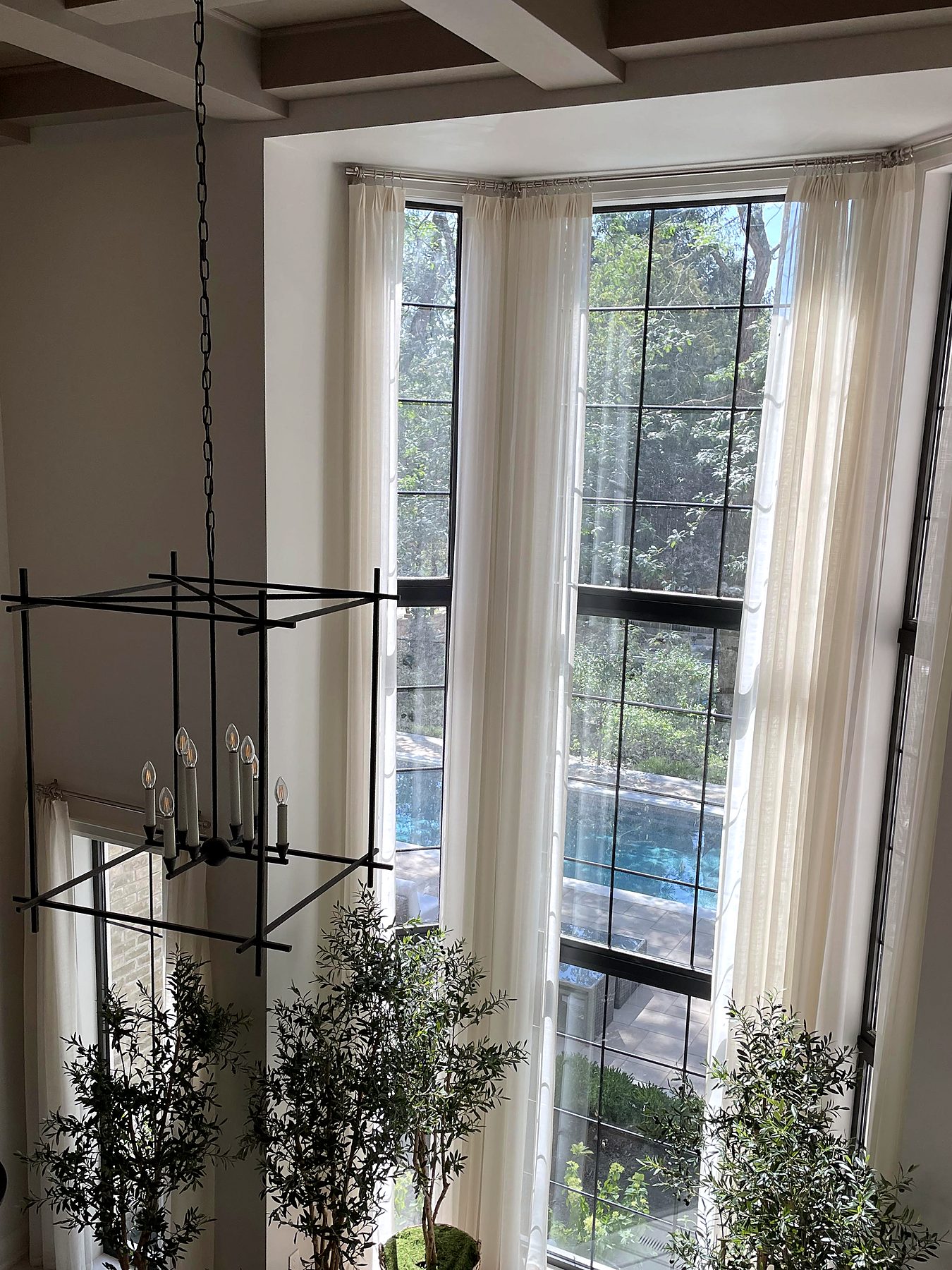Double-height windows with floor-to-ceiling sheers