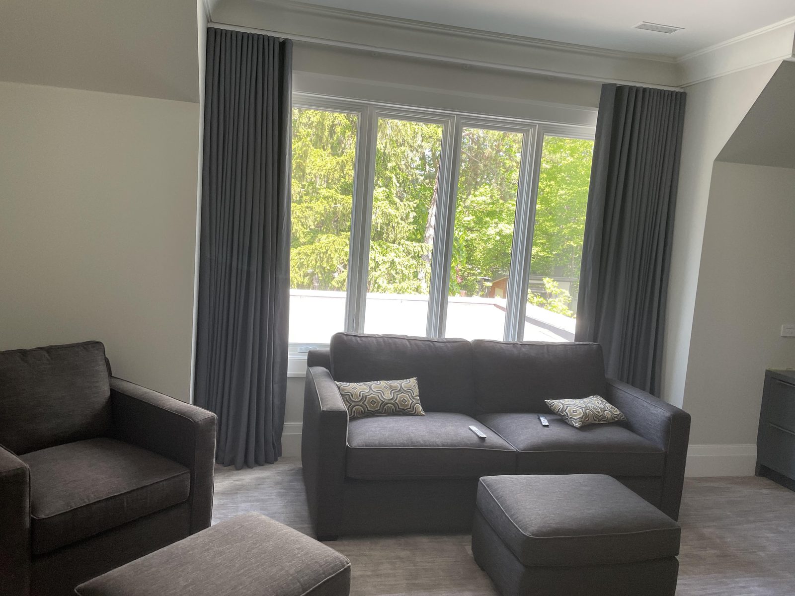 Family room with charcoal drapery