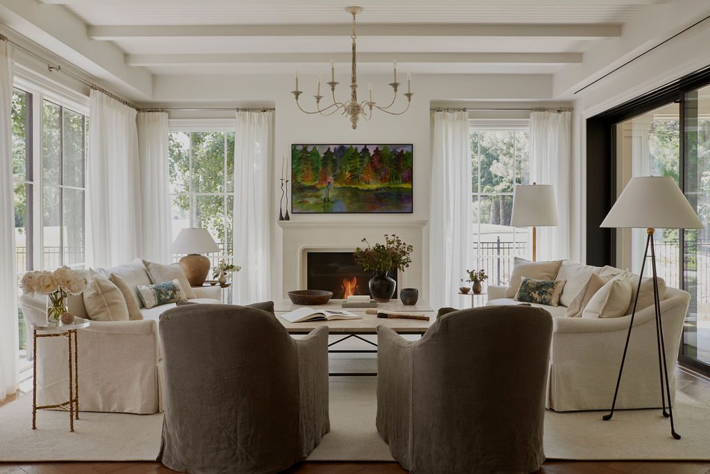 Living room with pleated sheer panels at every window